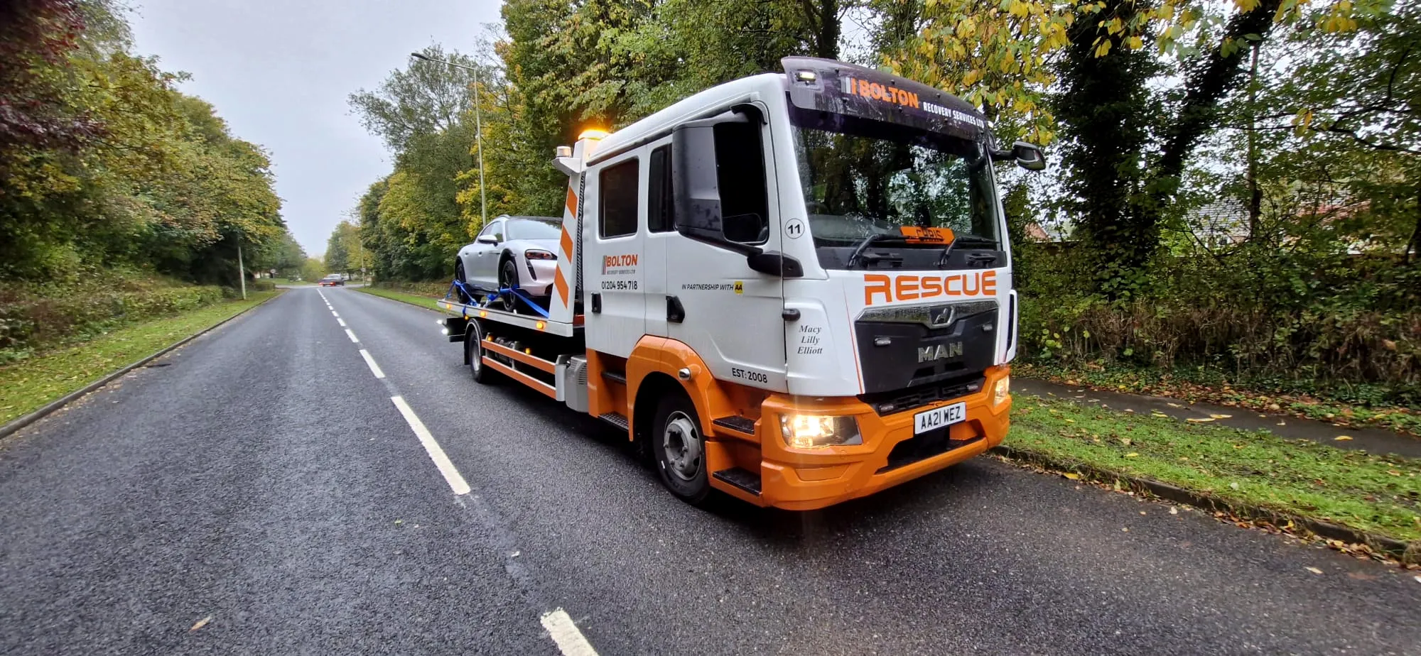 Bolton Recovery Services recovery truck loading a broken-down car for 24/7 car recovery in Bolton